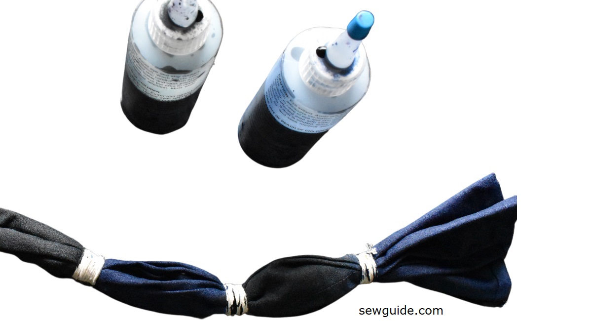 Applying dye to tied fabric using squeeze bottles