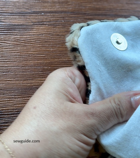 the snap of the pouch