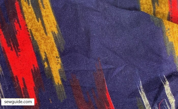 Printed fabric imitating ikat textile patterns
