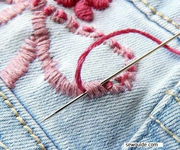 the satin stitches are tied with another thread to form small butterfliers