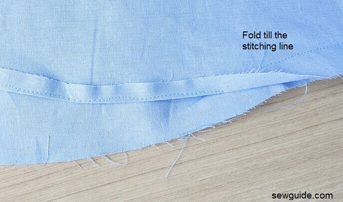 Hem the bottom edge