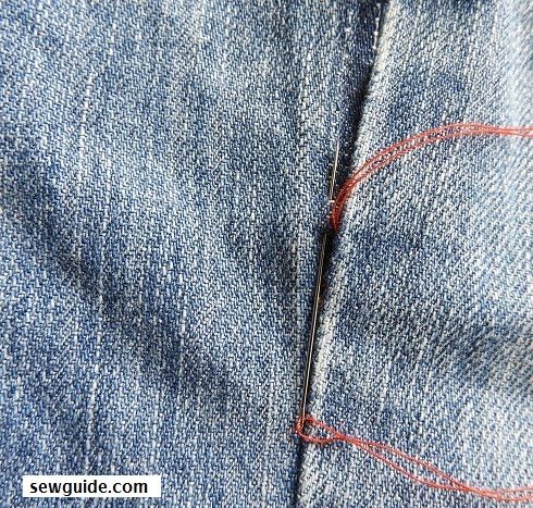 hand sewing a seam from the outside with ladder stitches