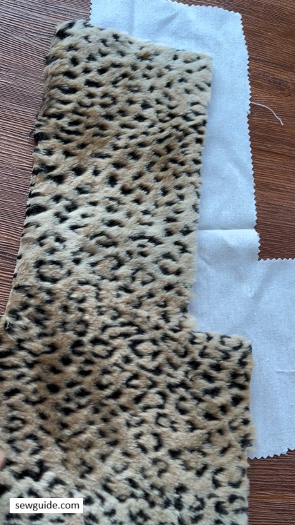 pattern cut for the pouch from faux fur and lining cloth