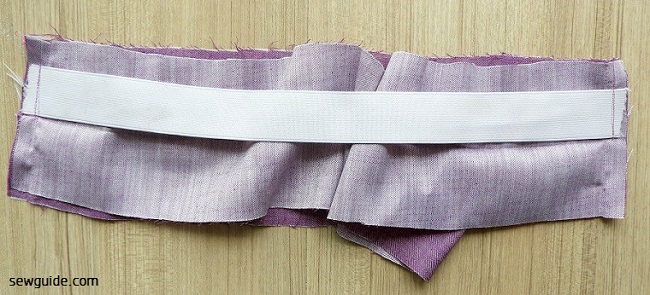 Stretch the elastic to meet the other end