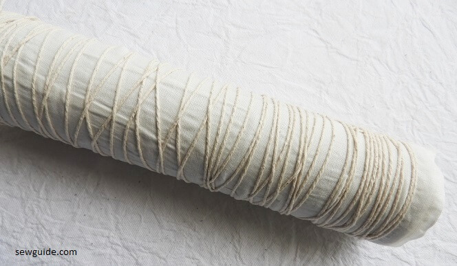 Fabric wrapped around a tube for pole-wrap tie-dye patterns