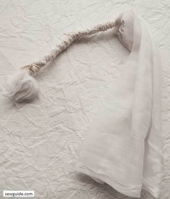 Twisting and tying fabric for tie-dyeing
