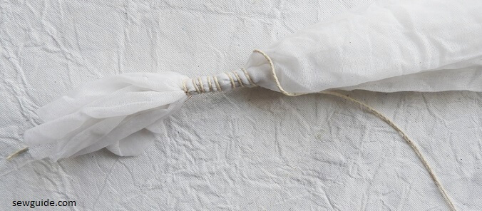 Scrunched fabric prepared for tie-dyeing