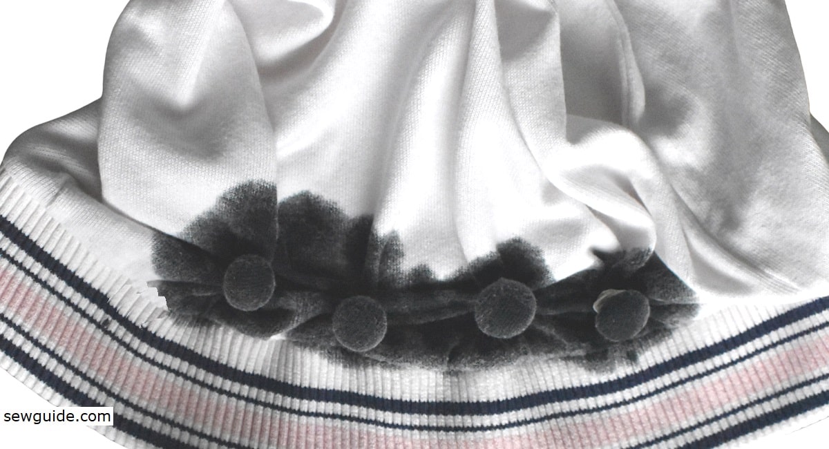 Tie-dyeing a cotton sweatshirt using tied coins