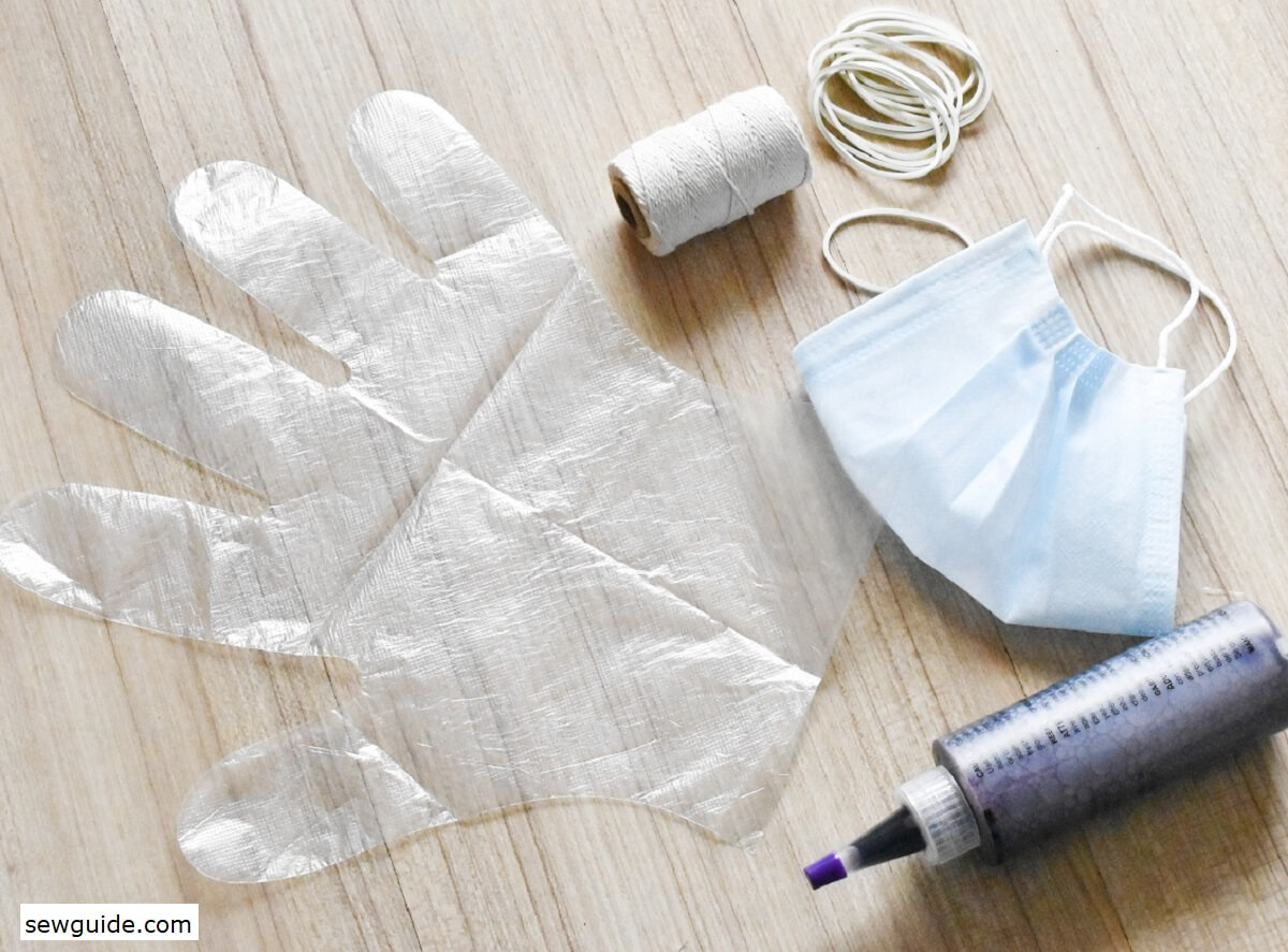 Tie-dye supplies including gloves, mask, rubber bands, and squeeze bottles