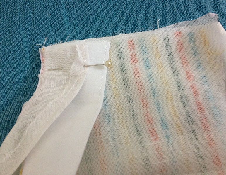 Turn the back and front facing to one side and pin in place