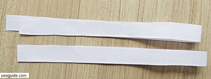 cut out handle pieces -2 interfacing pieces in this dimension - 25 inches long and 1 inch