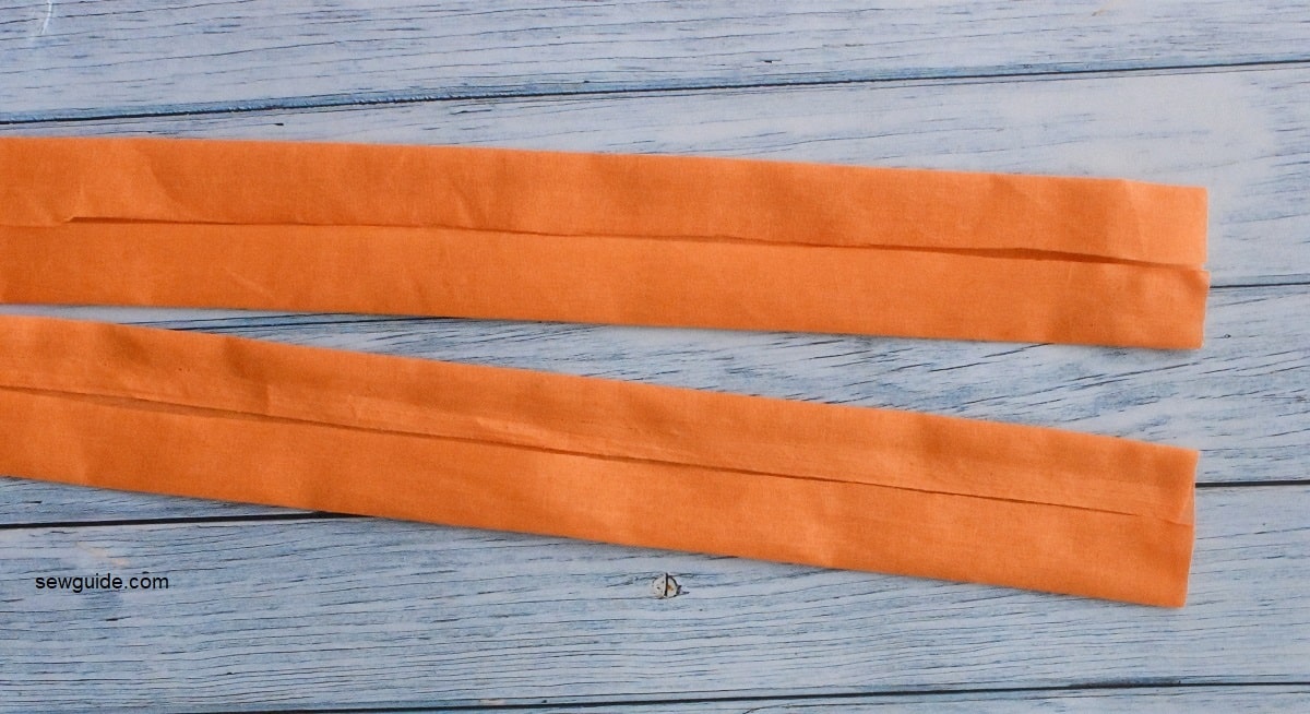 fold edges of the bag handle fabric to the middle