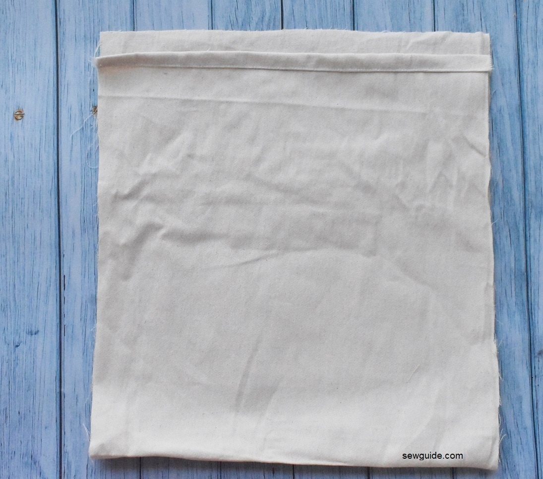 Finish the top edges of the bag fabric