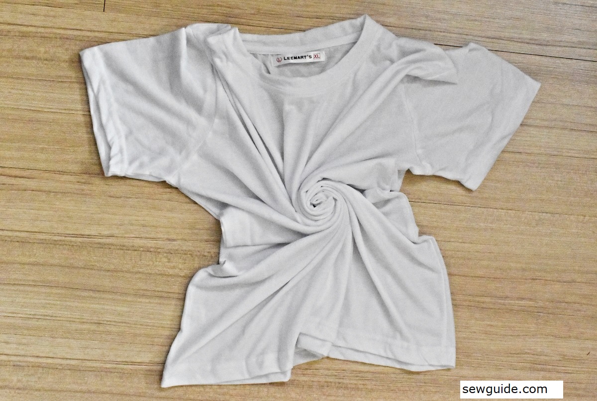 Twisting a T-shirt into a spiral coil for tie-dyeing
